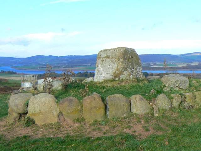 The ancient stone base of Macduff's Cross near Newburgh, Fife, surrounded by a ring of stones